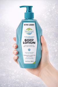 Hand holding a bottle of Kyn Loom body lotion against a light background
