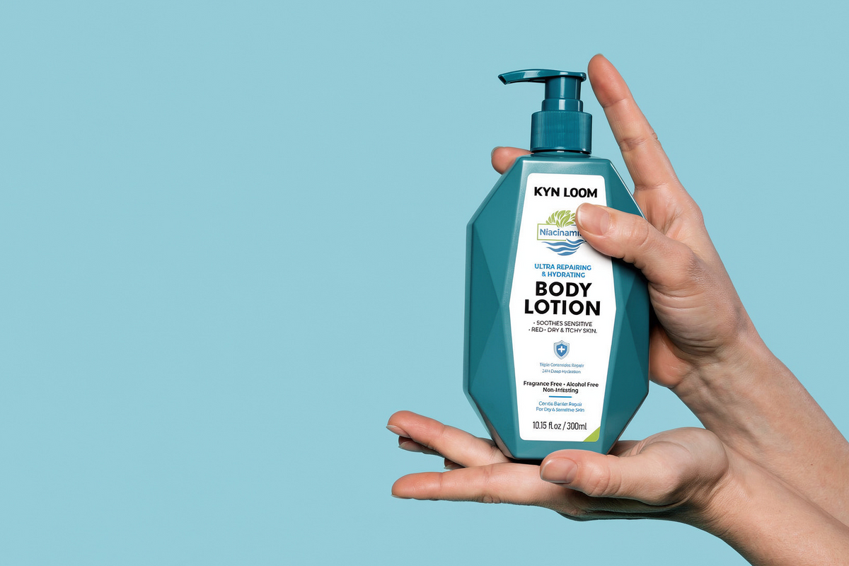 Hand holding a bottle of Kyn Loom body lotion against a light blue background